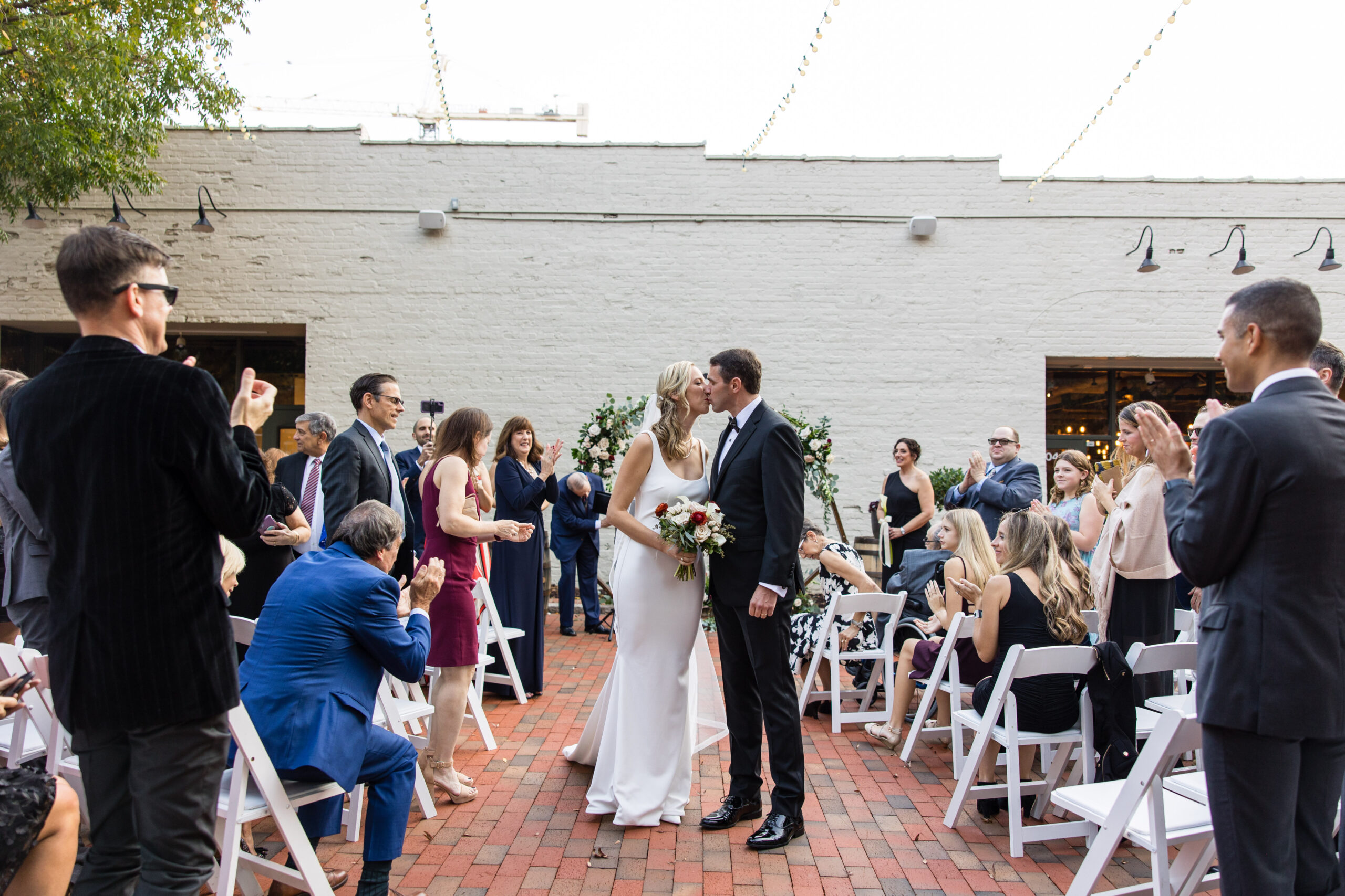 Bride and groom kiss after taking their vows