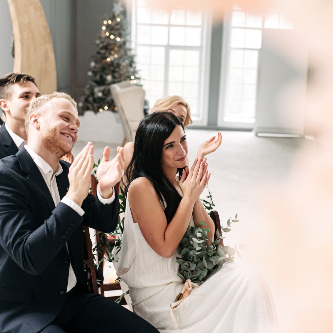 Wedding guests clapping